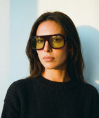 Model wearing Marlowe bold flat-top square sunglasses in burgundy red with green lenses