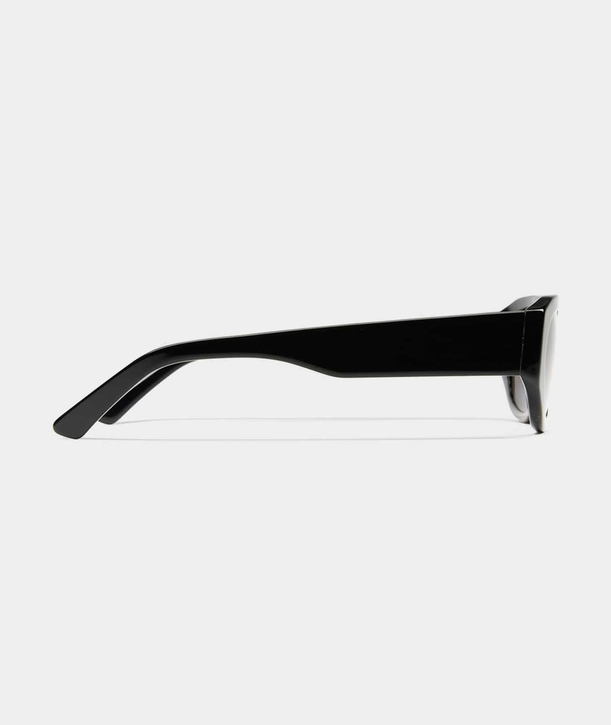 Amara chunky geometric sunglasses in black with gray lenses, side view