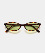 Cleo cat-eye sunglasses in tortoise with green lenses, front view
