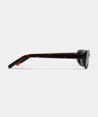 Iselle slim oval cat-eye sunglasses in tortoise with gray lenses, side view