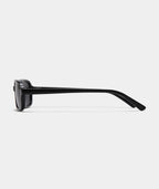 Maelle slim rectangular sunglasses in black with gray lenses, side view