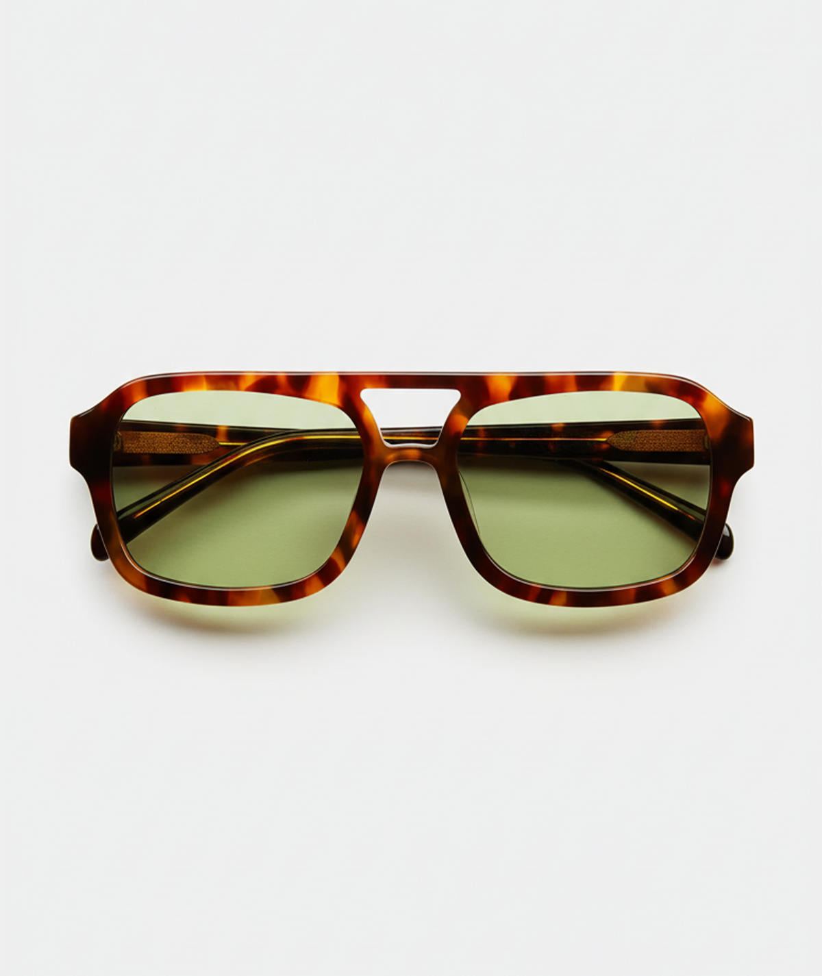 Mirage aviator sunglasses in tortoise with green lenses, front view