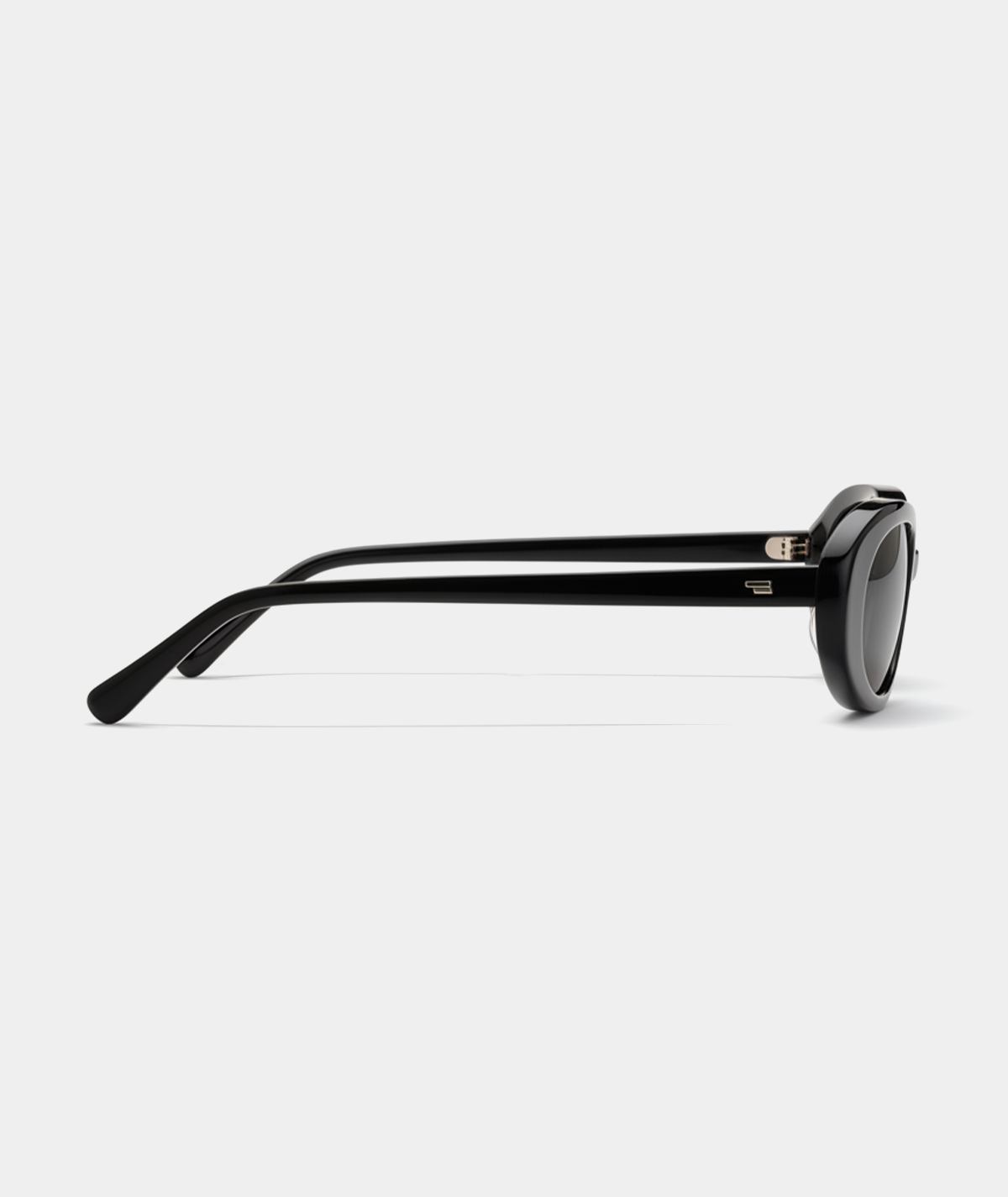 Solene oval sunglasses in black with gray lenses, side view