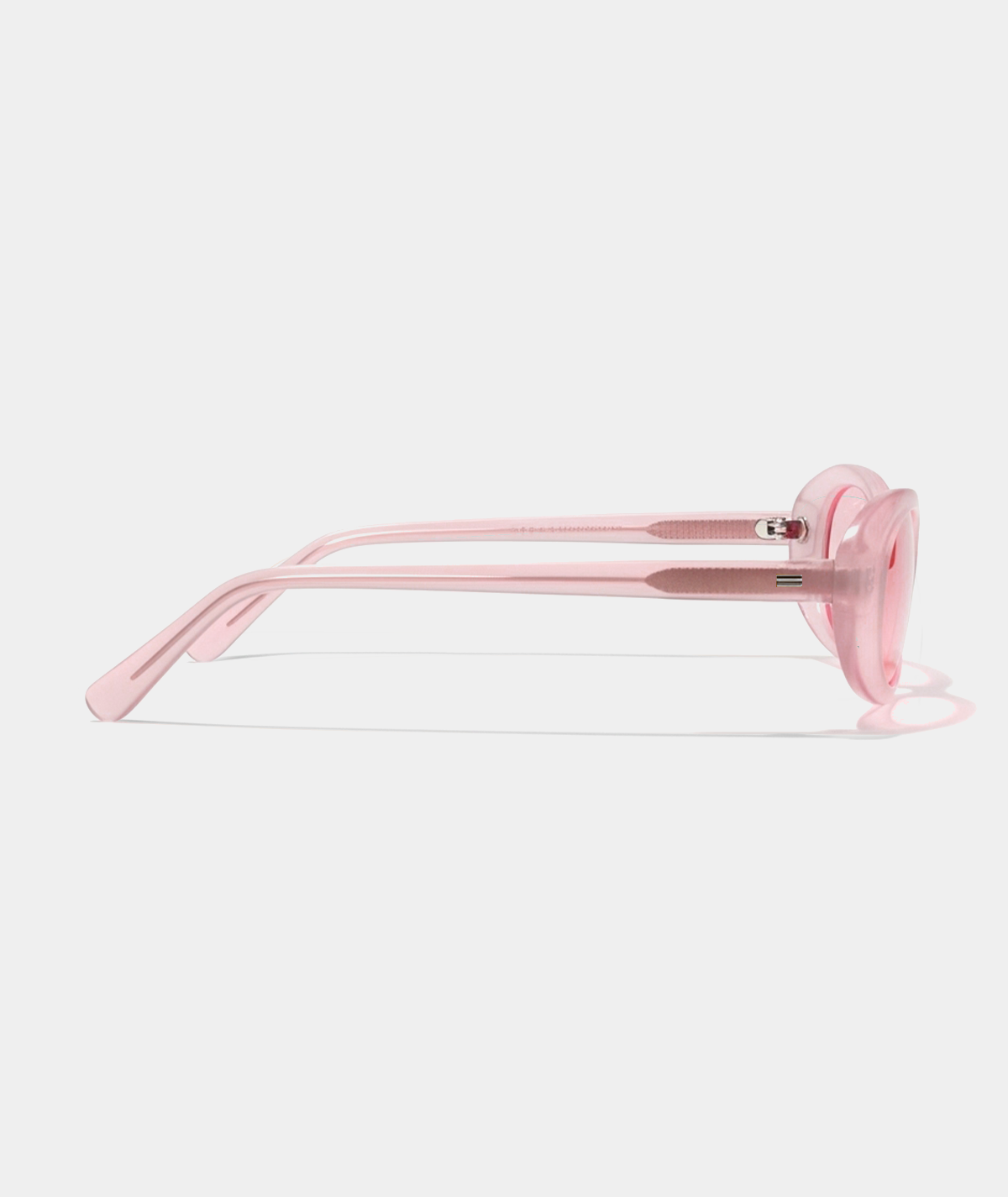 Solene oval sunglasses in transparent pink with pink lenses, side view