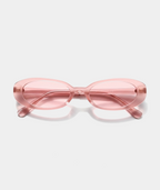 Solene oval sunglasses in transparent pink with pink lenses, front view