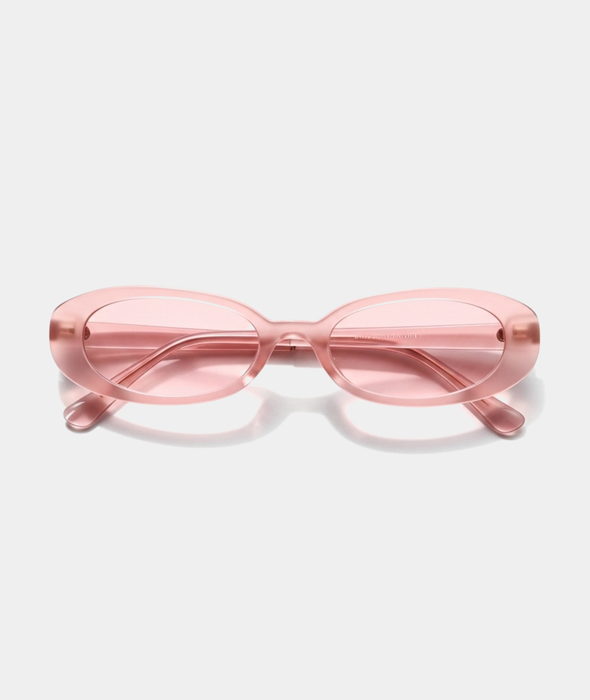 Solene oval sunglasses in transparent pink with pink lenses, front view