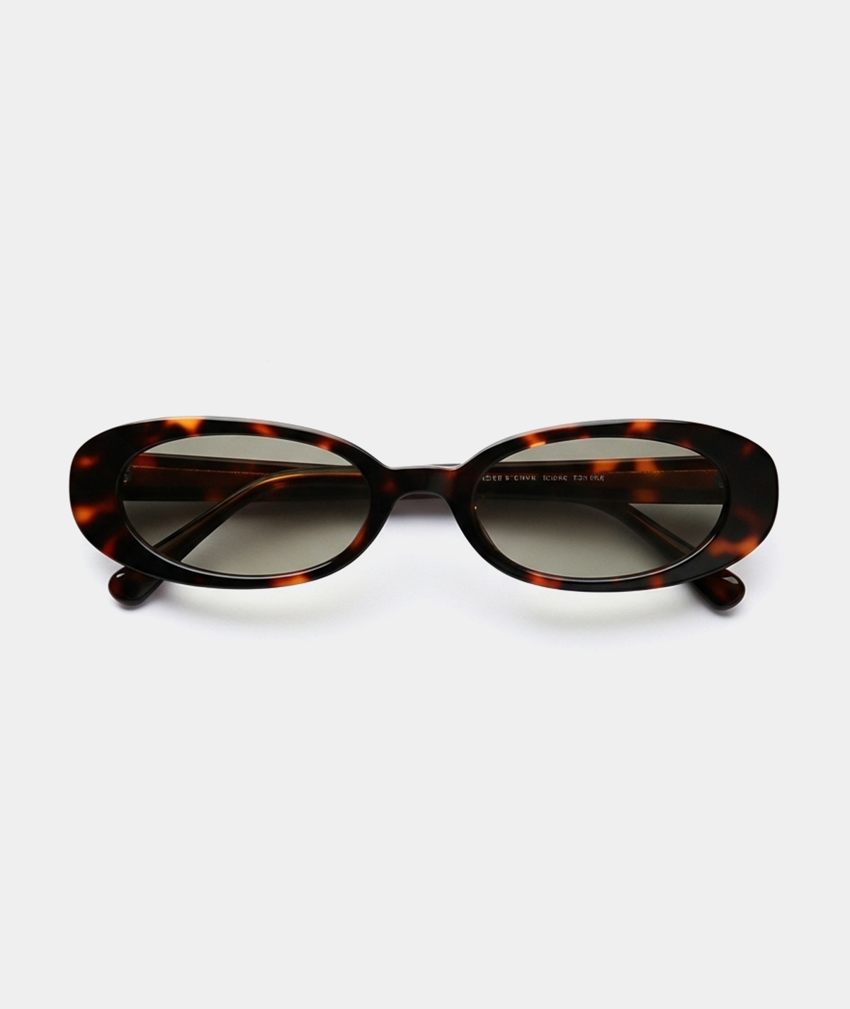 Solene oval sunglasses in tortoise with green lenses, front view